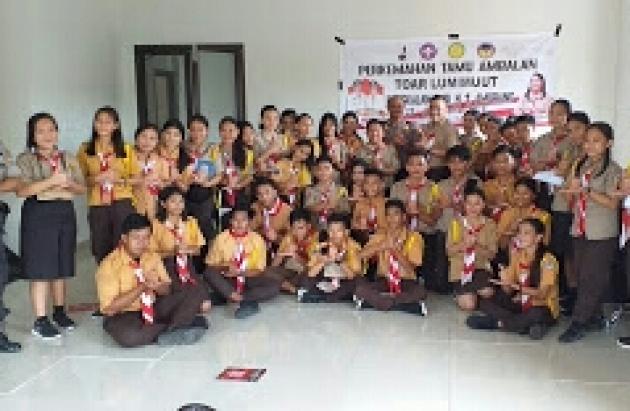 Sambangi Lokasi Perkemahan, Kasat Binmas Polres Minsel Berikan Materi